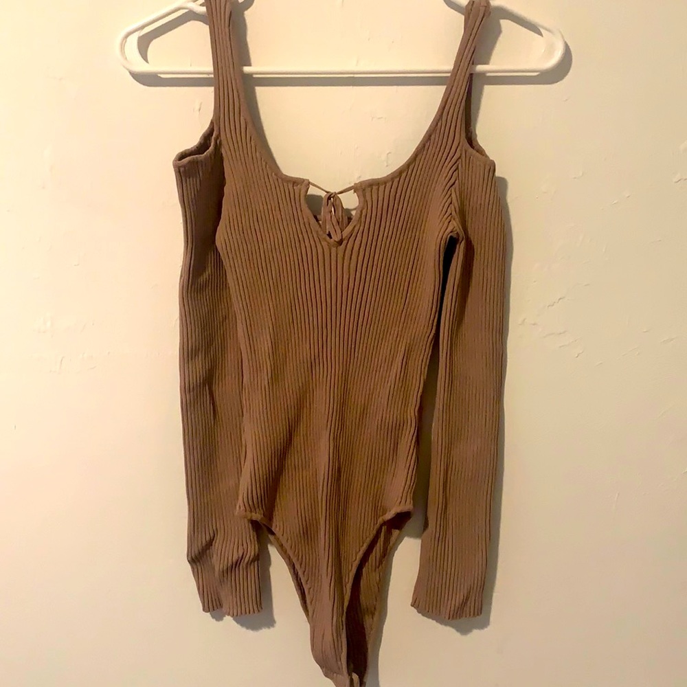 Tan colored bodysuit with open shoulder sleeves